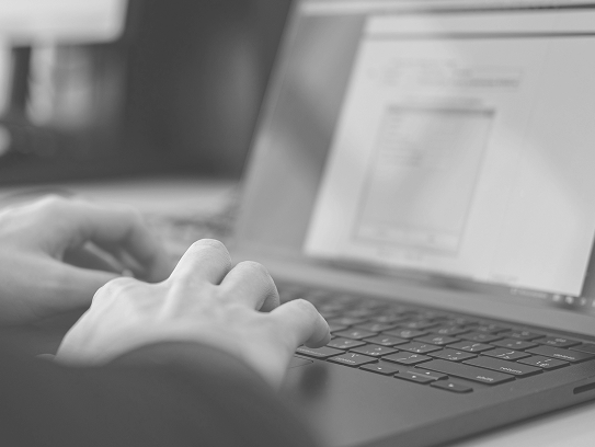 Reviewing surf footage on a laptop